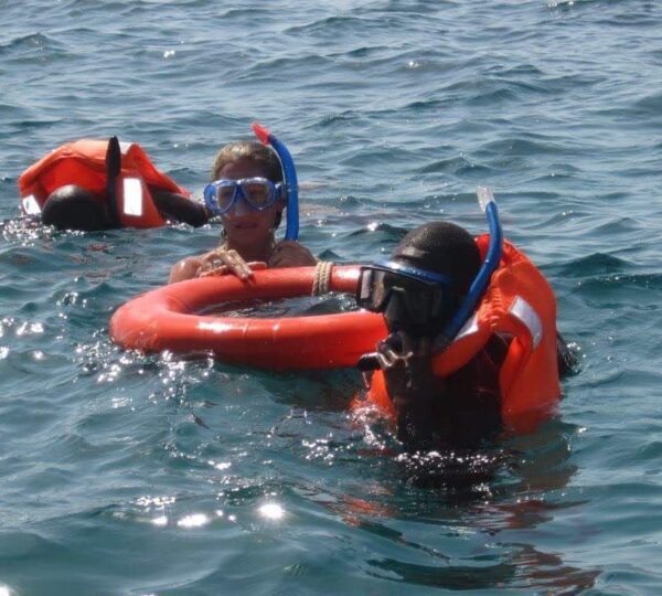 Children snorkeling in the waters of Wasini Island