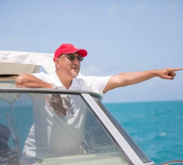 Tourist pointing out marine life during Wasini dolphin tour