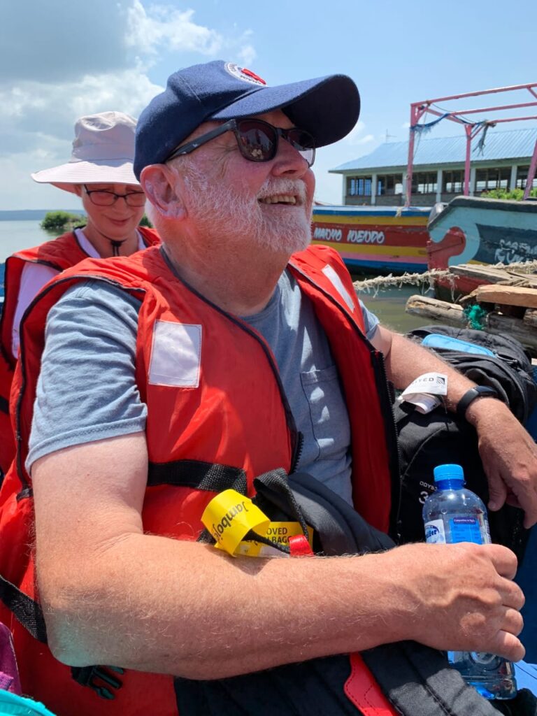 Man smiling during Lake Victoria boat tour