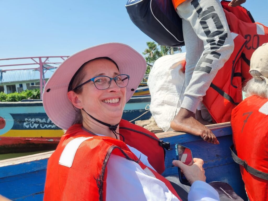 Happy tourist in life vest on Lake Victoria cruise