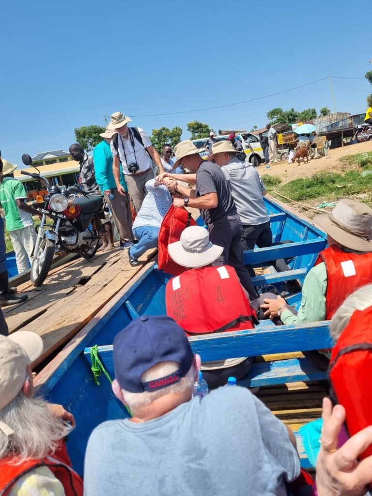 Tourists boarding a boat for Lake Victoria cruise